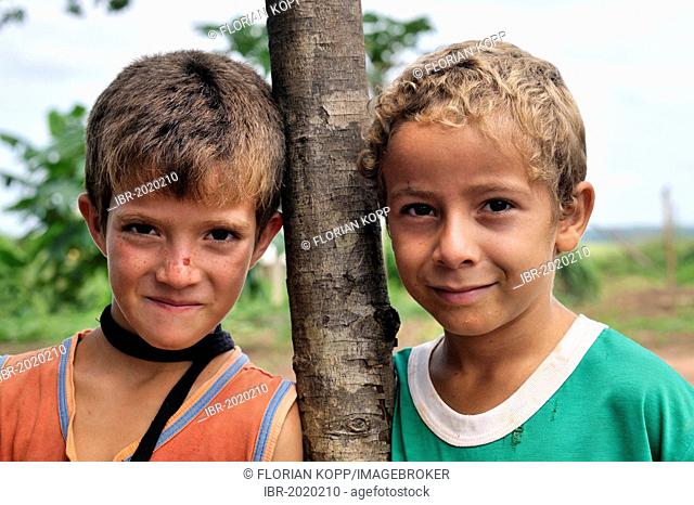 Two boys, friends, Acampamento 12 de Otubro landless camp, Movimento dos Trabalhadores Rurais sem Terra, a Brazilian landless movement, MST, Munizip Claudia