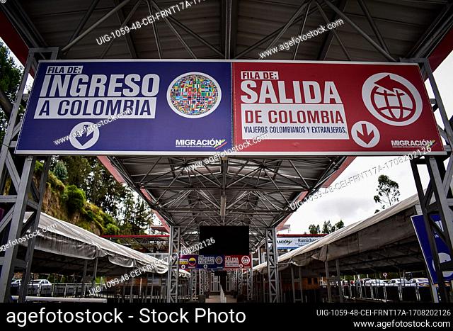 Signs that show lines for people entering Colombia from Ecuador (Left) and for people leaving Colombia to Ecuador (Right) as drivers of public service vehicles...