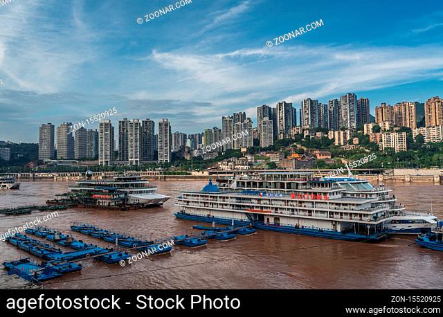 Chongqing, China - August 2019 : Luxury passengers cruise ships ready to depart from Chongqing wharf on a trip through the Three gorges on the Yangtze river in...