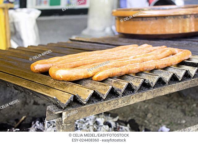 Fried sausage on barbecue, restaurant and food