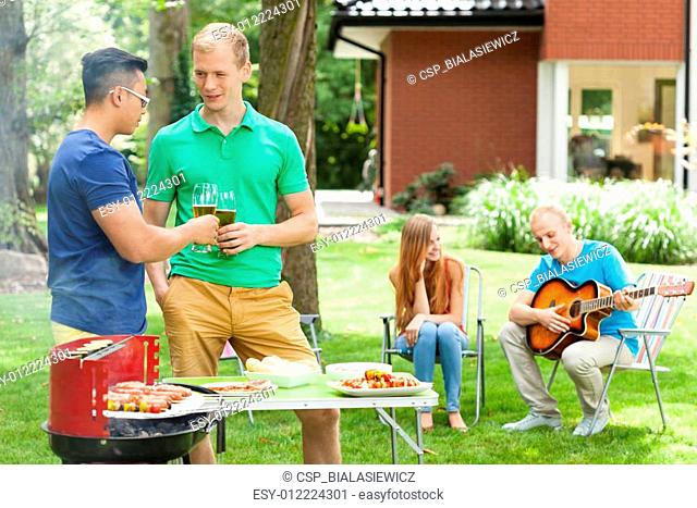 Friends talking on a garden party