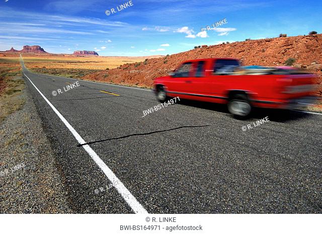 Highway 163, street with red car, USA, Arizona, Utah, Navajo Tribal Park