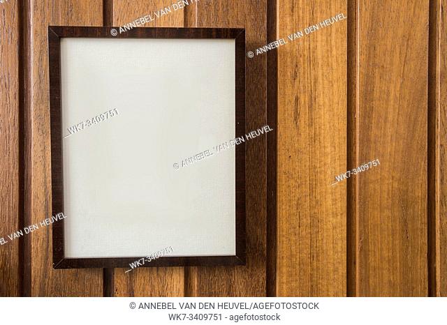 Empty Frame on wooden wall, background texture, with space for text, close-up