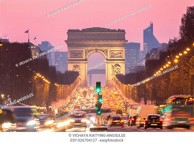 Paris Arc of Triomphe along Champs-Elysees France sunset