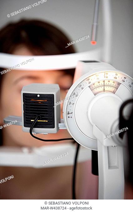 young woman having her eye's tested