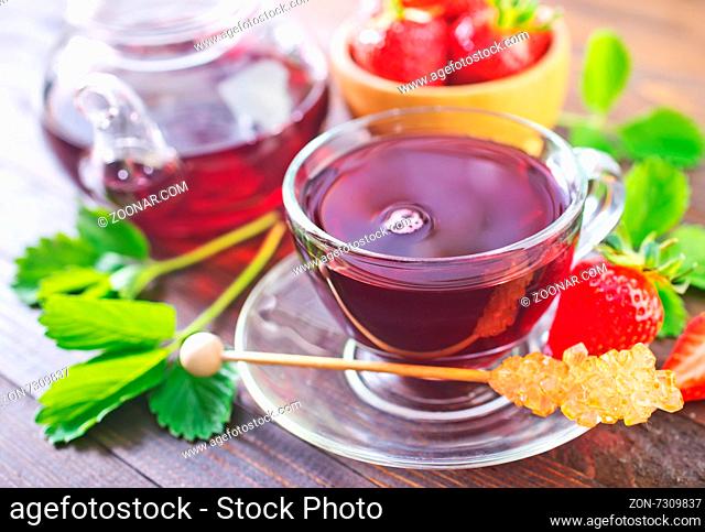 strawberry tea in cup and on a table