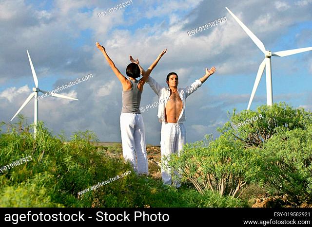 woman lifting arm nearly opposite wind