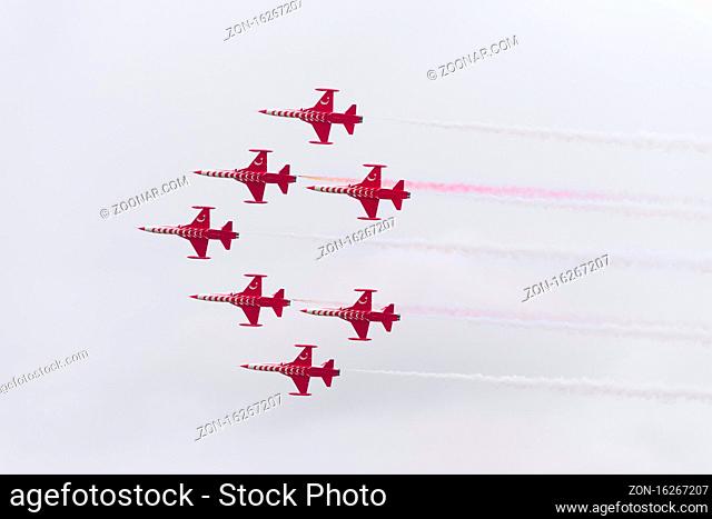 LEEUWARDEN, NETHERLANDS - JUNE 6, 2016: Turkish Star air force demonstration tean performing their stunts during the Dutch Air Force open days
