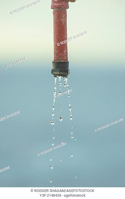 Dripping nozzle on a beach shower. Dalebrook Tidal Pool, Cape Town, South Africa