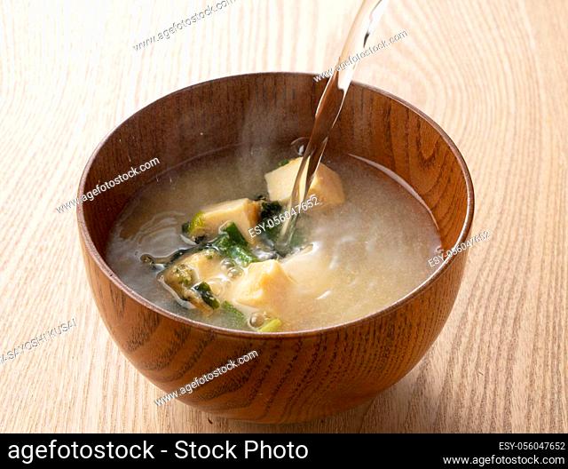Pour hot water into a bowl of freeze-dried miso soup