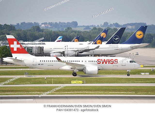 HB-JCI - Bombardier CS300 - Swiss aircraft on the runway in the background Lufthansa machines. Airline, airline, flyer, air traffic, fly.Aviation
