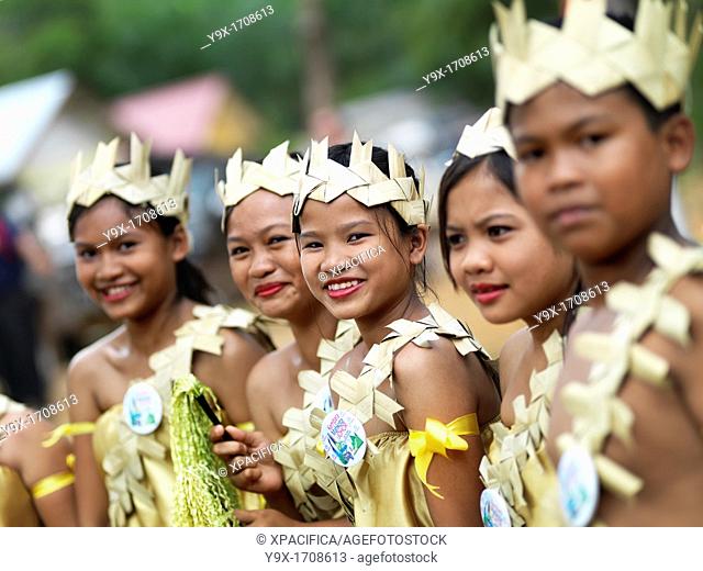 Orang Asli children, or aboriginal children, dressed in their traditional ceremonial attire to greet the Crowned Prince of Johor during his annual trip around...
