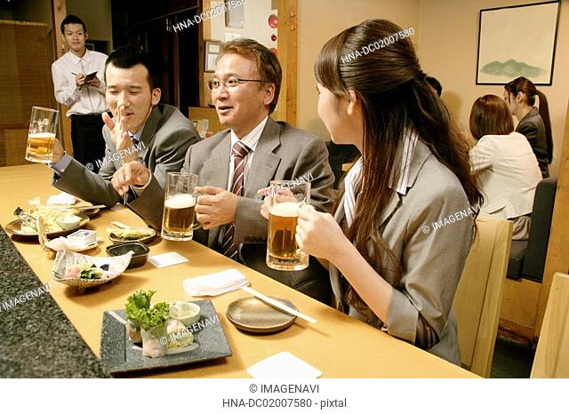 Man and woman chatting in the Japanese-style pub