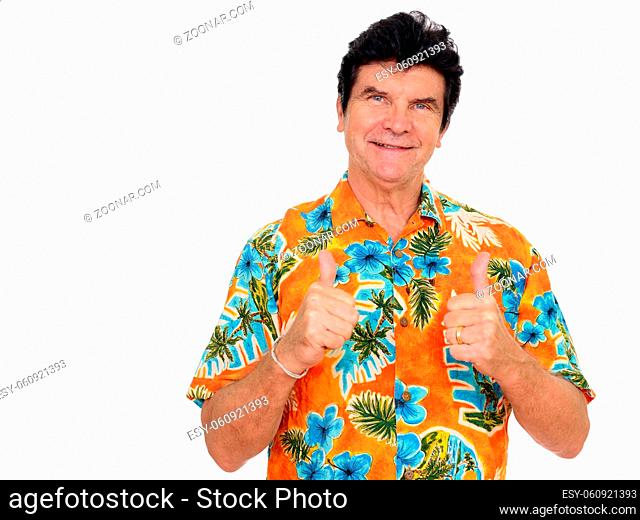Studio shot of mature handsome tourist man ready for vacation isolated against white background