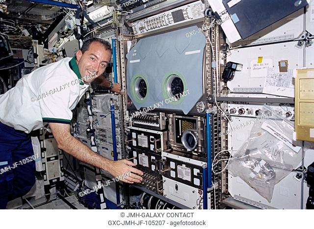 Astronaut Philippe Perrin, STS-111 mission specialist, floats near the Microgravity Science Glovebox (MSG) in the Destiny laboratory on the International Space...