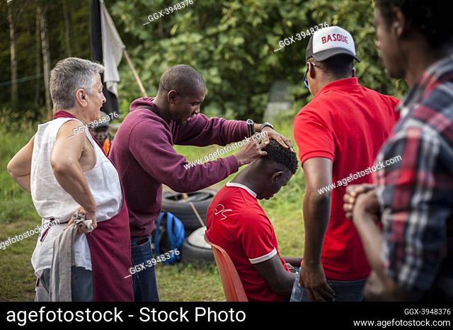 A migrant grooms another one's hair in Lakaxita. Irun (Basque Country). August 30, 2018. Lakaxita is a self-managed socio-cultural space located in an occupied...