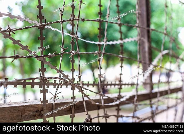 Cambodia, Phnom Penh, Tuol Sleng Museum of Genocidal Crime, Khmer Rouge prison formerly known as Prison S-21, located in old school, barbed wire