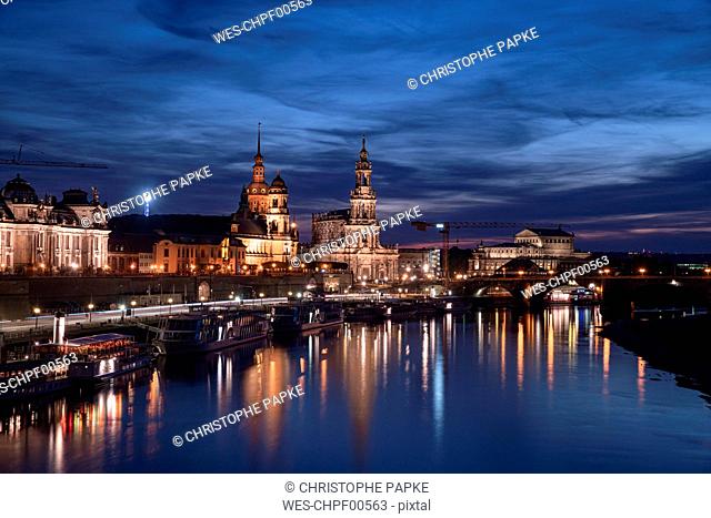 Elbe river by Hofkirche und Semperoper against sky in city at night, Saxony, Germany