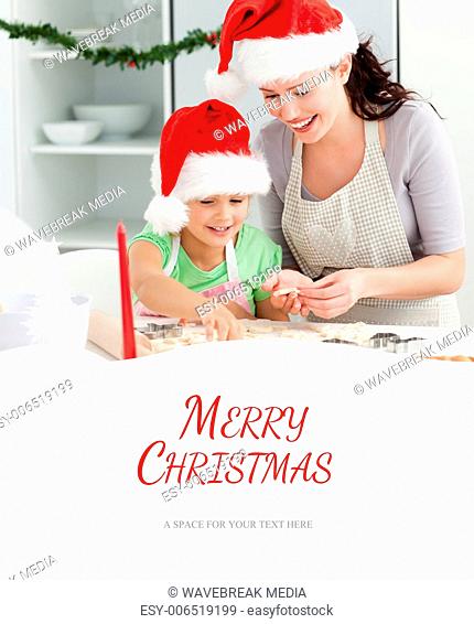 Composite image of lovely mother and daughter preparing christmas cookies