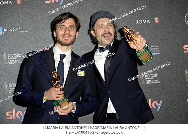 Luca Marinelli Best Supporting actor prize and Claudio Santamaria Best actor prize at the red carpet of winners for the David of Donatello prize, Rome