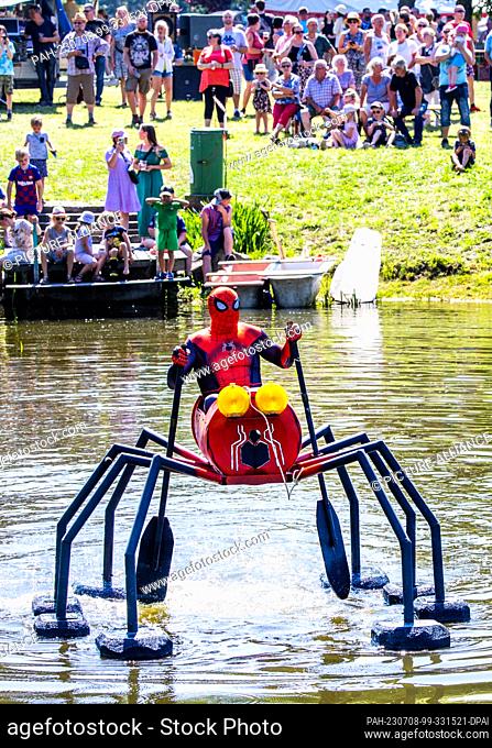 08 July 2023, Mecklenburg-Western Pomerania, Pokrent: With an elaborate construction ""Spider-Man"" starts at the traditional bathtub regatta on the village...