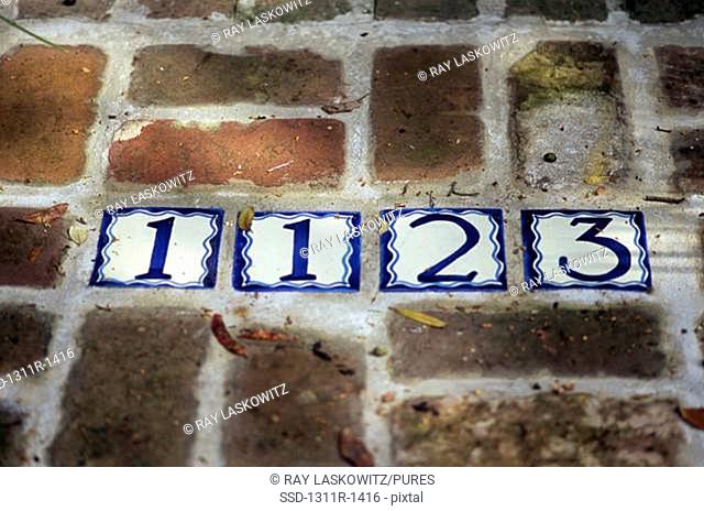 Numbers in a brick floor