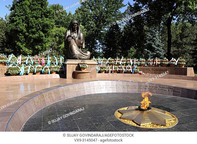 Tashkent, Uzbekistan - May 12, 2017: View of Crying Mother monument and eternal flame at Independence square