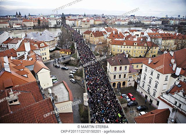 People follow funeral car with remains of Vaclav Havel, the first president of Czech Republic and the last president of Czechoslovakia