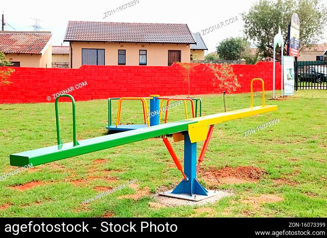 Soweto, South Africa - December 11, 2010: Seesaw at local public park playground