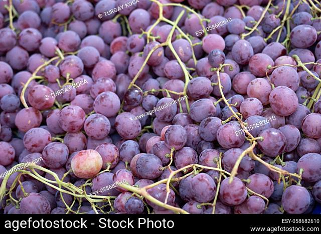 Fresh ripe red grapes in the market. Red grapes background