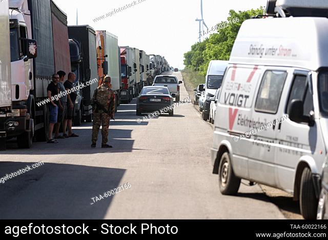 RUSSIA, KHERSON REGION - JUNE 23, 2023: Vehicles queue to pass the Armyansk checkpoint between the Kherson Region and Crimea