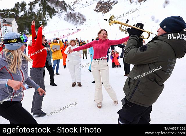 RUSSIA, KABARDINO-BALKAR REPUBLIC - DECEMBER 9, 2023: People attend a concert marking the start of the winter season at the Elbrus ski resort