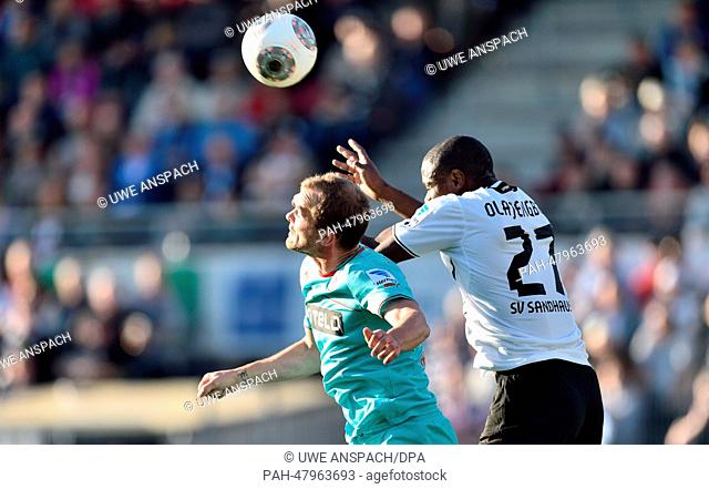Duesseldorf's Erwin Hoffer (L) and Sandhausen's Seyi Olajengbesi vie for the ball during the German 2nd Bundesliga soccer match between SV Sandhausen 1916 and...