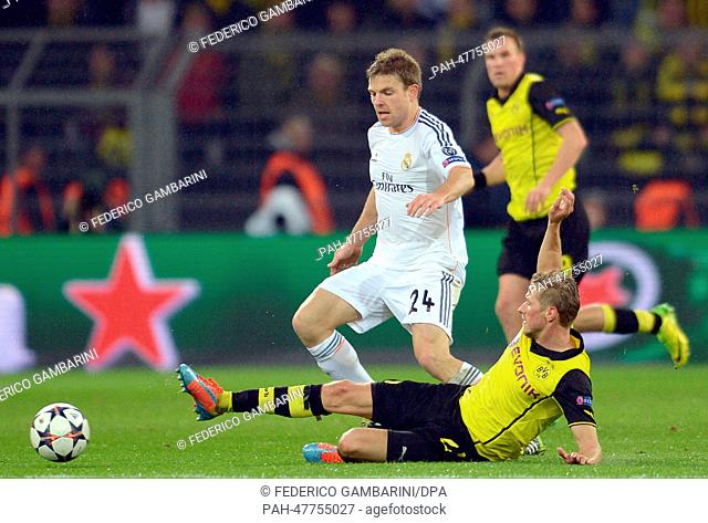 Dortmund's Oliver Kirch (R) in action against Madrid's Asier Illarramendi during the UEFA Champions League quarter-final second leg soccer match between...