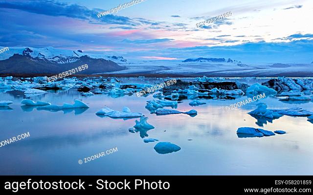 Jokulsarlon, glacier lagoon in Iceland at night with ice floating in water. Cold arctic nature landscape scenery. Ice melting