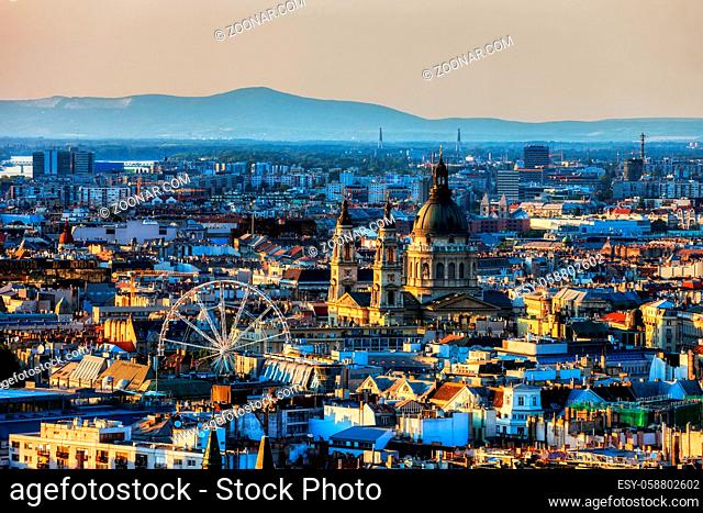 Budapest at sunset, capital city of Hungary cityscape with St. Stephen's Basilica and Ferris Wheel