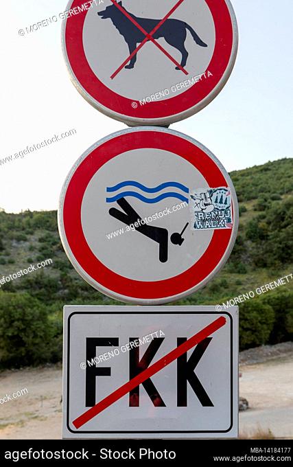 Signs at the entrance of a beach in Croatia where nudism / naturism is prohibited