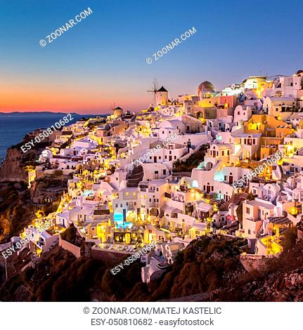 World famous Oia village or Ia at sunset, Santorini island, Greece