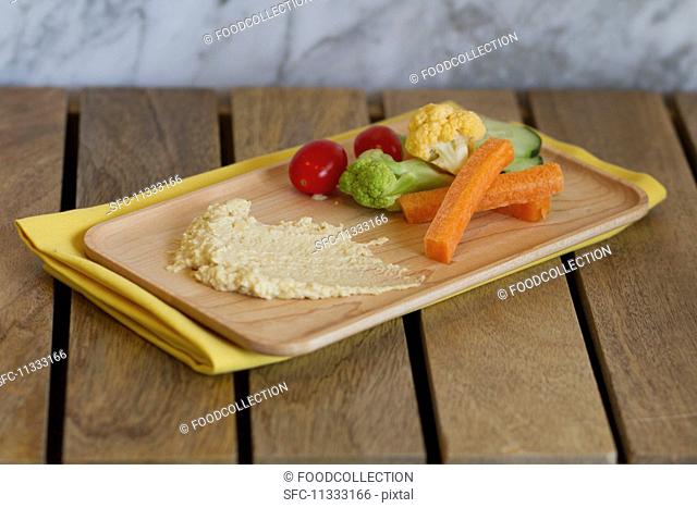 A plate of hummus and vegetables