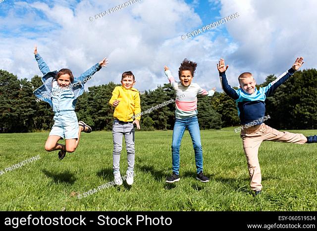 happy children jumping and having fun at park