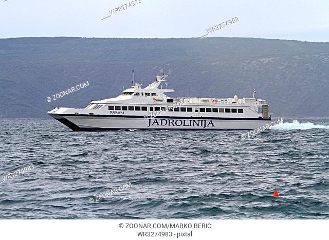 CRES, CROATIA - MAY 16: Jadrolinija Dubravka catamaran on MAY 16, 2010. High speed Jadrolinija Dubravka catamaran vessel approaching Cres island, Croatia