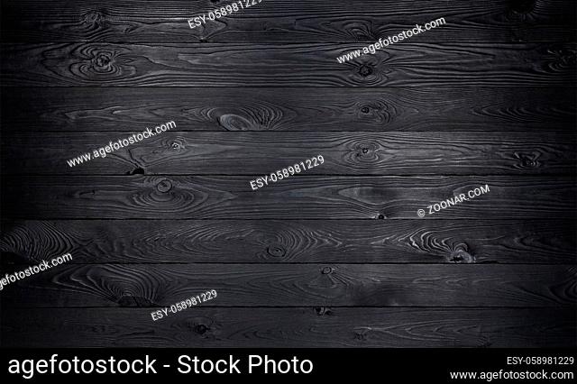 Black wooden background, old wooden planks texture, dark coal wall for product