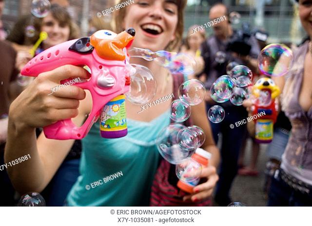 Participants in a 'Bubble Battle, ' whereby strangers gather at a particular place and time, and make bubbles in any way possible
