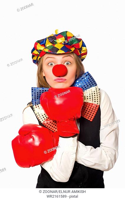 Pretty female clown with box gloves isolated on white