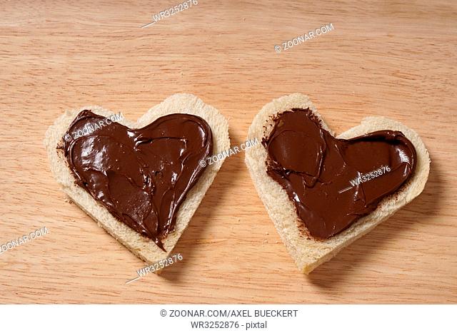 two heart shaped bread slices with chocolate spread as Valentines day concept