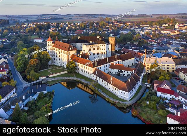 Aerial view just after sunrise of the castle, pond and town with its renaissance architecture in the town of Jindrichuv Hradec in the Czech Republic