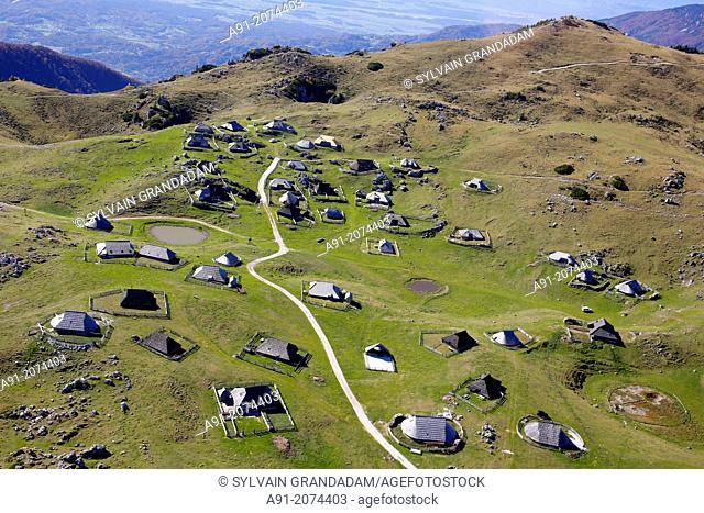 Slovenia, above Kamnik valley the Velika Planina plateau with traditional shepherd house made of wood, aerial