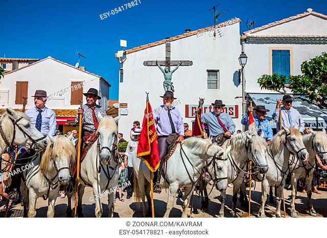 Sent-Mari-de-la-Mer, Provence, France - May 25, 2015. World Festival of Gypsies. Convoy - guards on white horses before the start of the parade