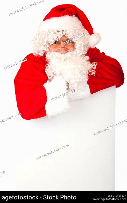 Happy smiling Santa Claus is leaning on Christmas special offer