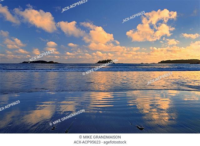 Clouds reflecting in Pacific Ocean at Long Beach at sunrise Pacific Rim National Park British Columbia Canada
